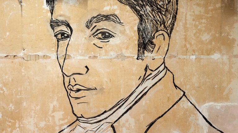 Large scale mural on a cream wall featuring an illustration of William Wordsworth's head in black charcoal ..